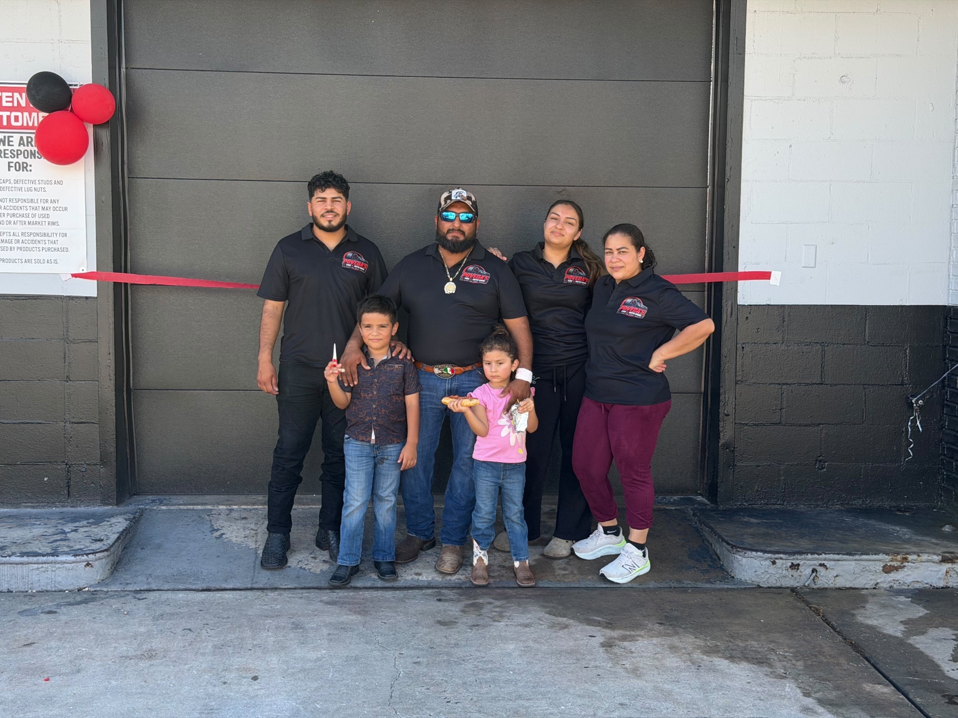 The Poveda family at the shop's grand opening